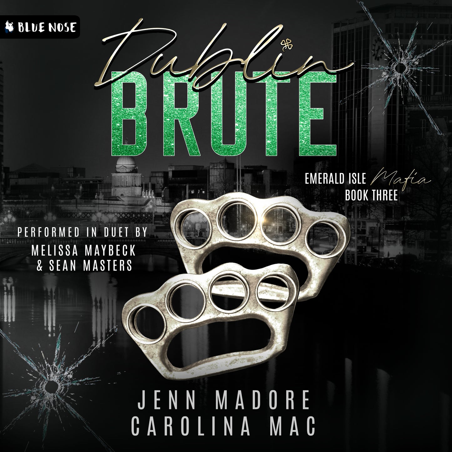 Audiobook cover for Dublin Bruteby Jenn Madore and Carolina Mac. Book 3 in the the Emerald Isle Mafia Series. Performed in duet by Melissa Maybeck and Sean Masters. Produced by Blue Nose AUDIO. Image of black and white scity, silver brass knuckles and cracked bullet-holed glass.