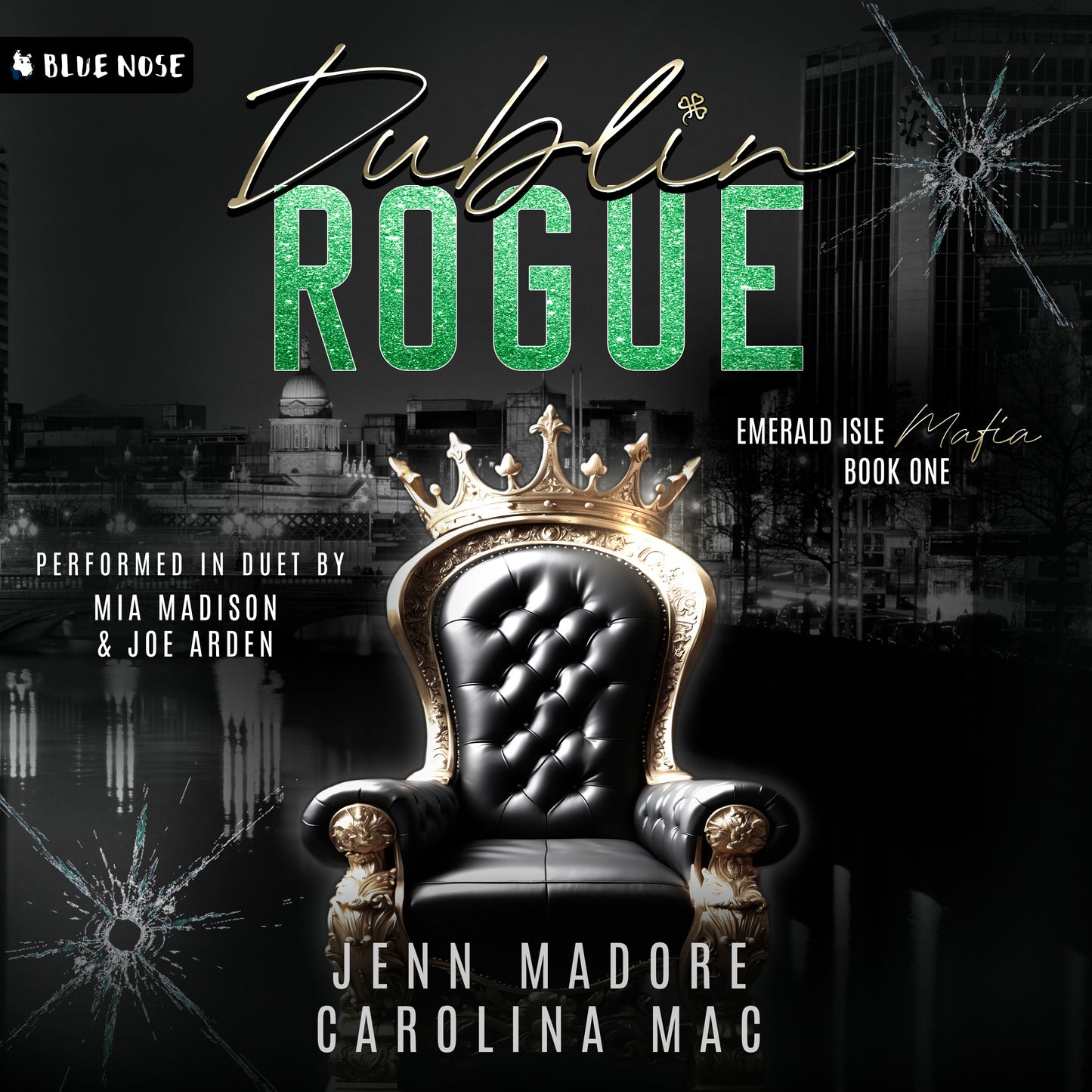 Audiobook cover for Dublin Rogue by Jenn Madore and Carolina Mac. Performed in DUet by Mia Madison and Joe Arden. Emerald Isle Mafia book 1. A black and gold armchair with a gold crown on the top over a black and white cityscape viewed through glass with bullet holes in it.