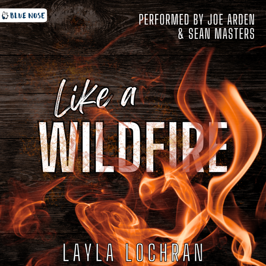 Audiobook cover for Like a Wildfire by Layla Lochran. Performed by Joe Arden and Sean Masters. Produced by Blue Nose AUDIO. Dark wood with flames winding through the title text.