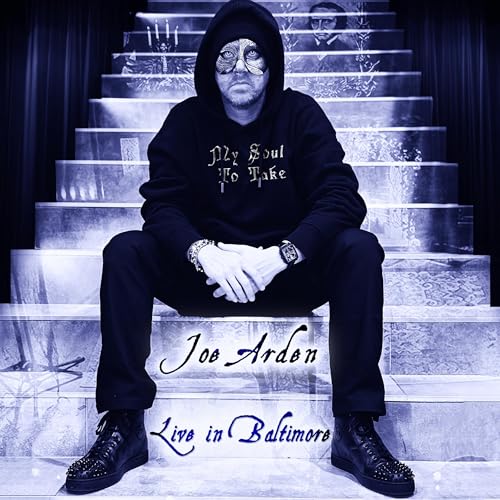 My Soul To Take-Joe Arden Live in Baltimore live stage show recording. Black and white photo of Joe sitting on stairs overlayed with a photo of Edgar Allan Poe and a winged candle wall sconce. Theatre curtains in the back framing the stairs.